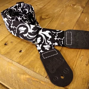 Bitchin' Black 'n' Blank guitar strap leather ends close-up, vivid high-contrast orange, Bold Black with White colours, real leather ends - Sexy Straps by Revel Threads