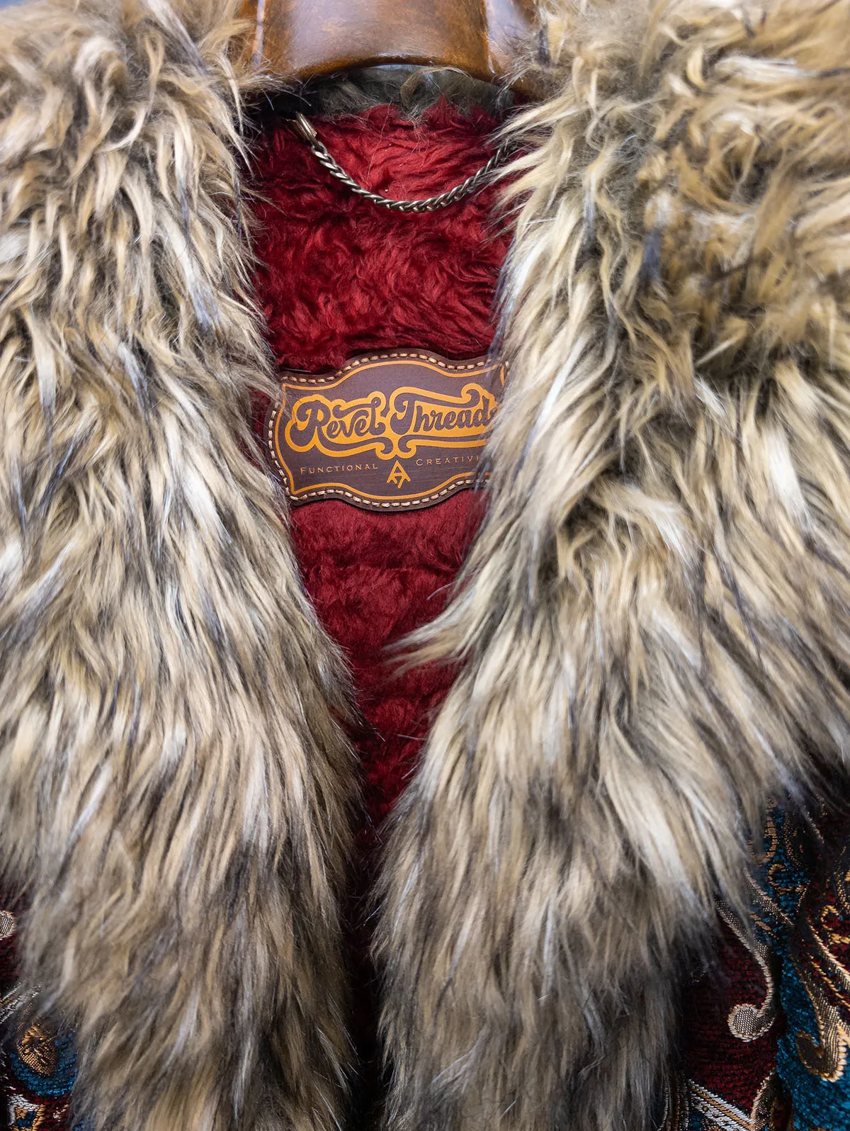 Huxley Luxe Festival Coat close up of logo patch and collar – premium festival coat by Revel Threads