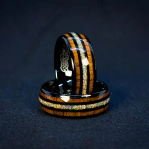 Charred Ember Ring dramatic low-light angle, tungsten carbide, crushed fire opal inlay, triple inlay design