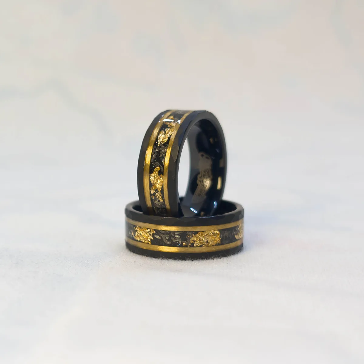 Stellar Drift Ring bright studio shot, tungsten carbide, meteorite and gold leaf inlay, dual gold stripes