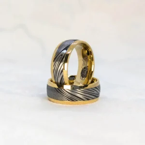 Wild Halo Ring bright studio view, gold base, steel and black damascus pattern, contrasting halo band