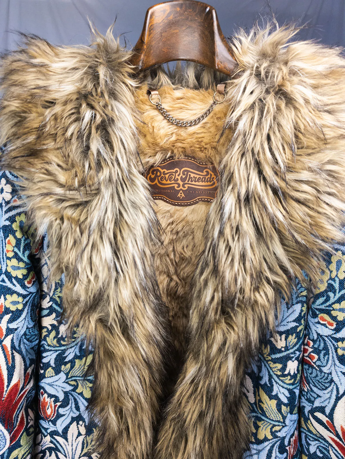 Shelley Luxe Festival Coat front view on a hanger – premium festival coat by Revel Threads